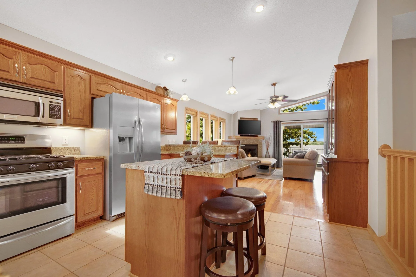 Inside you will find a bright and open floor plan that seamlessly connects the kitchen to the living room.