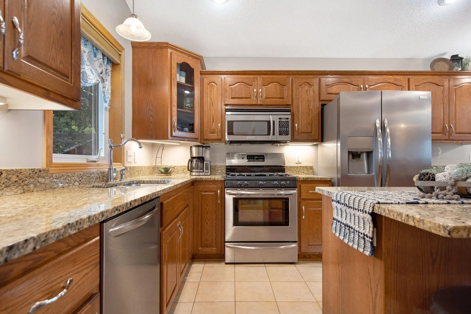 Kitchen has tons of counter and cabinets space.