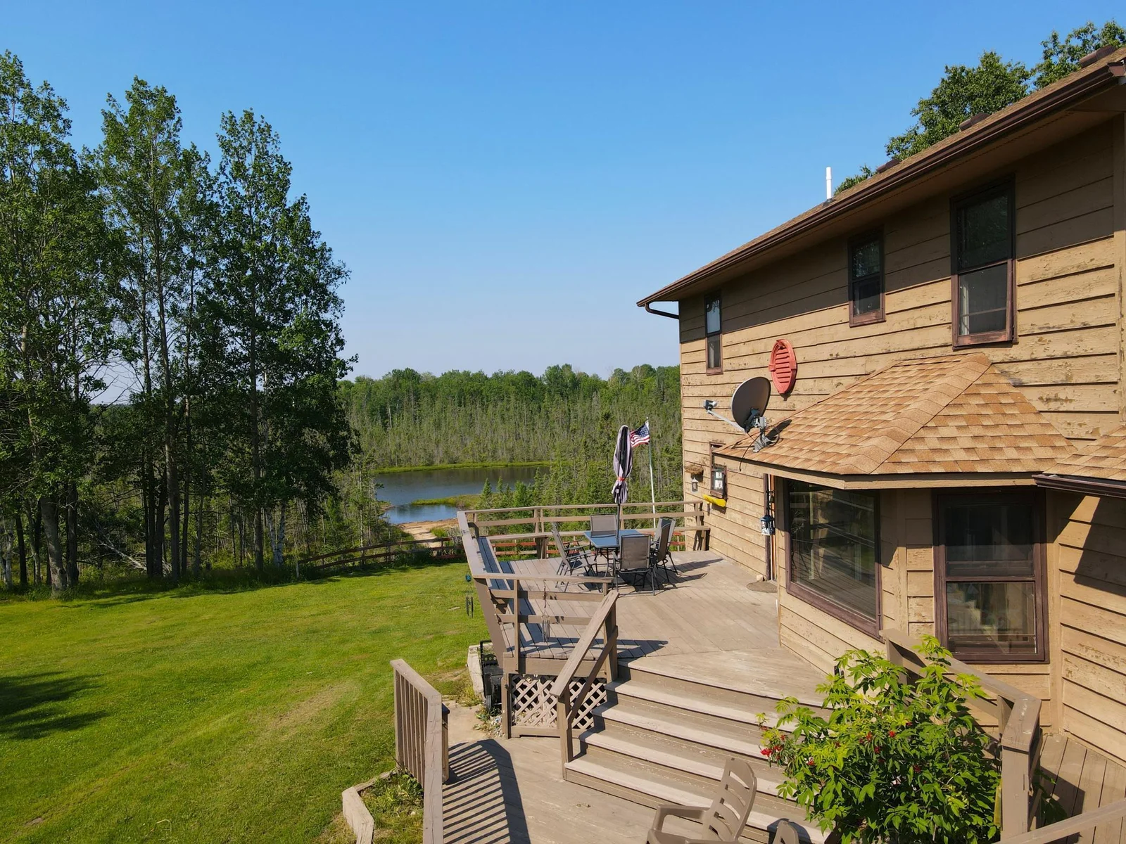 LARGE DECK AREA AND VIEWS OF THE POND.