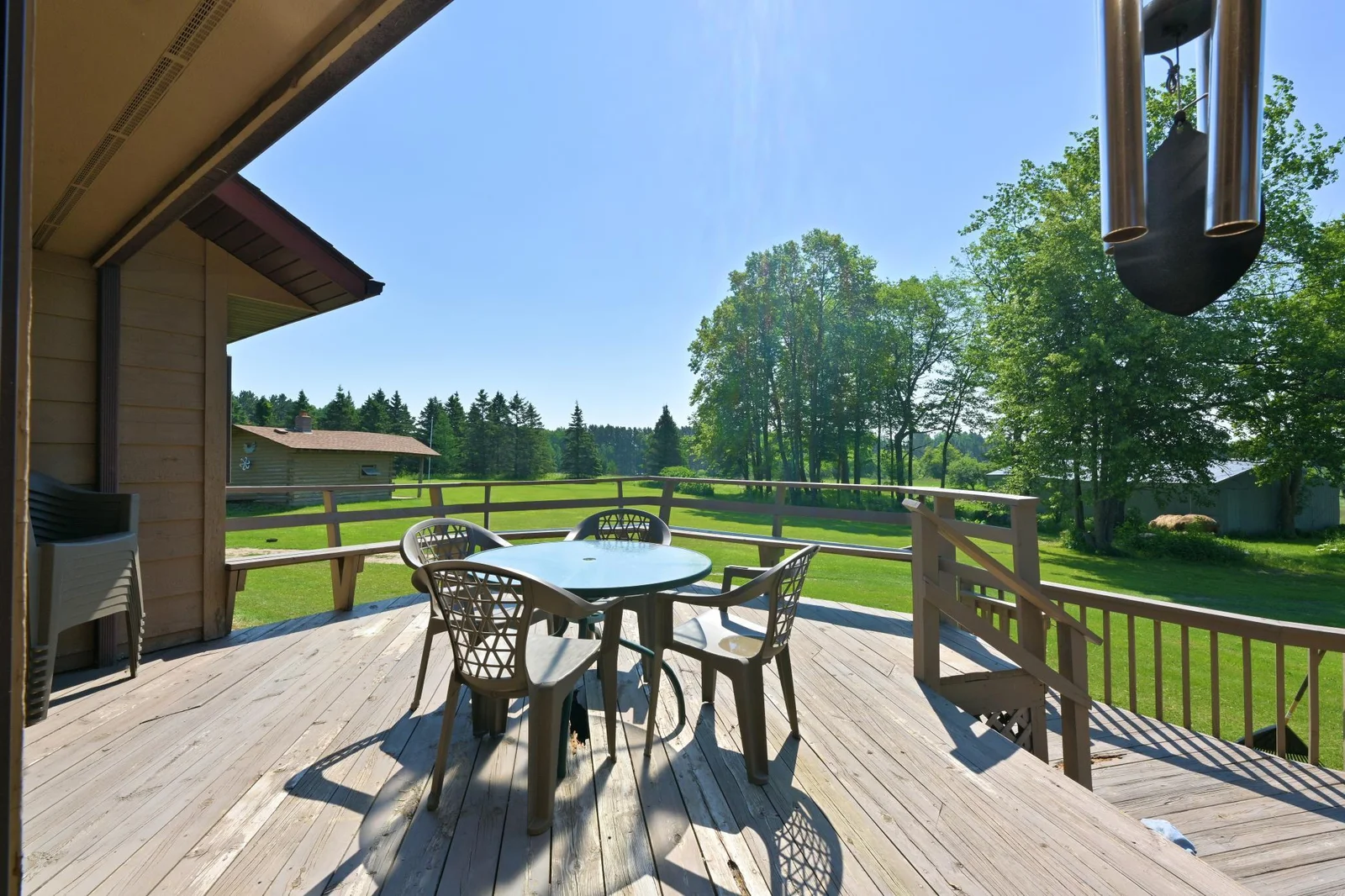 DECK VIEW OVERLOOKING THE LARGE BACKYARD