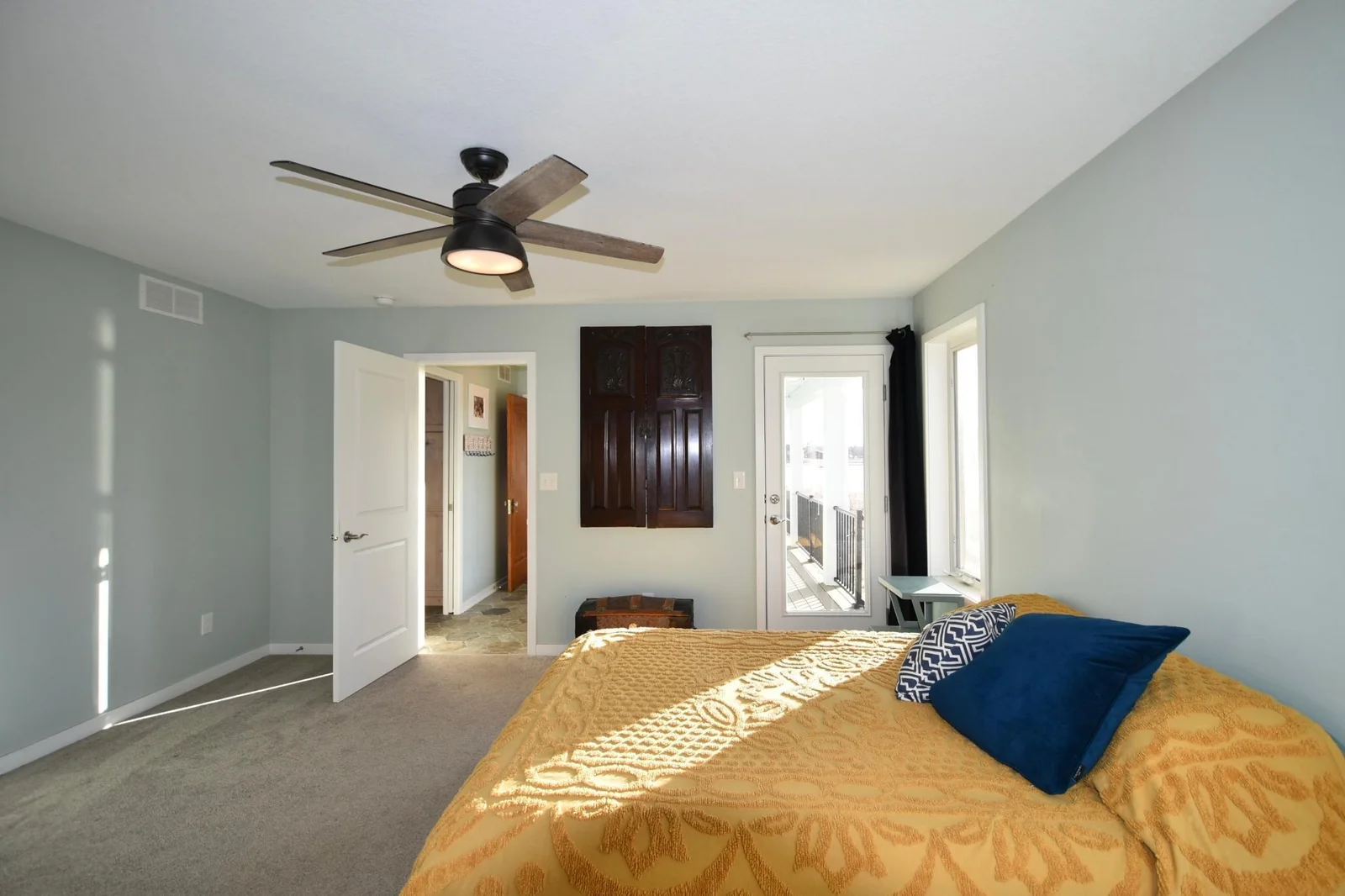 Master bedroom with patio door access to the covered wrap around porch to enjoy sunrise/sunsets