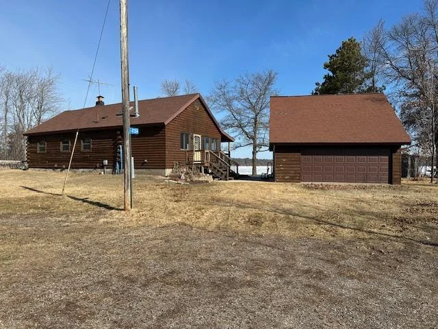 Well Maintained Log Home with Log Sided Sunroom & Garage