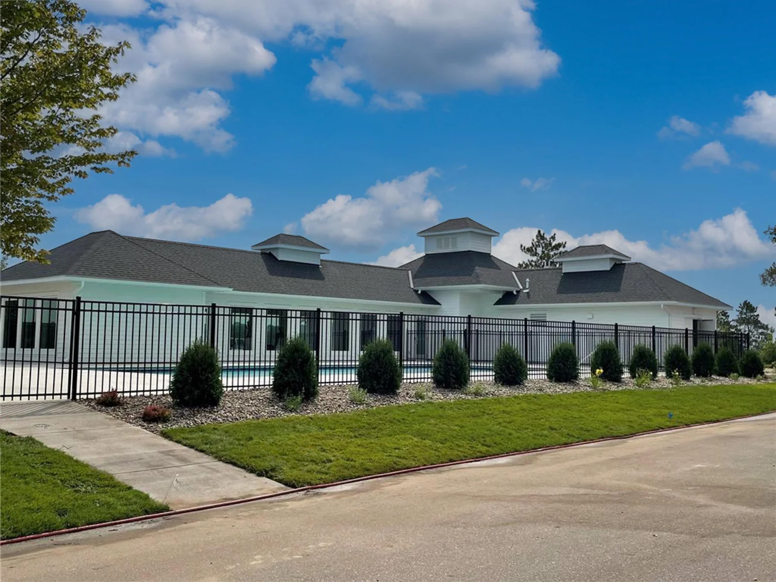 Clubhouse with in-ground swimming pool and workout room