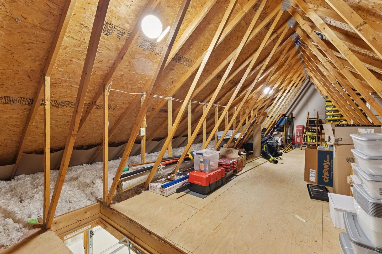 Attic storage area has flooring, LED lighting and power vents