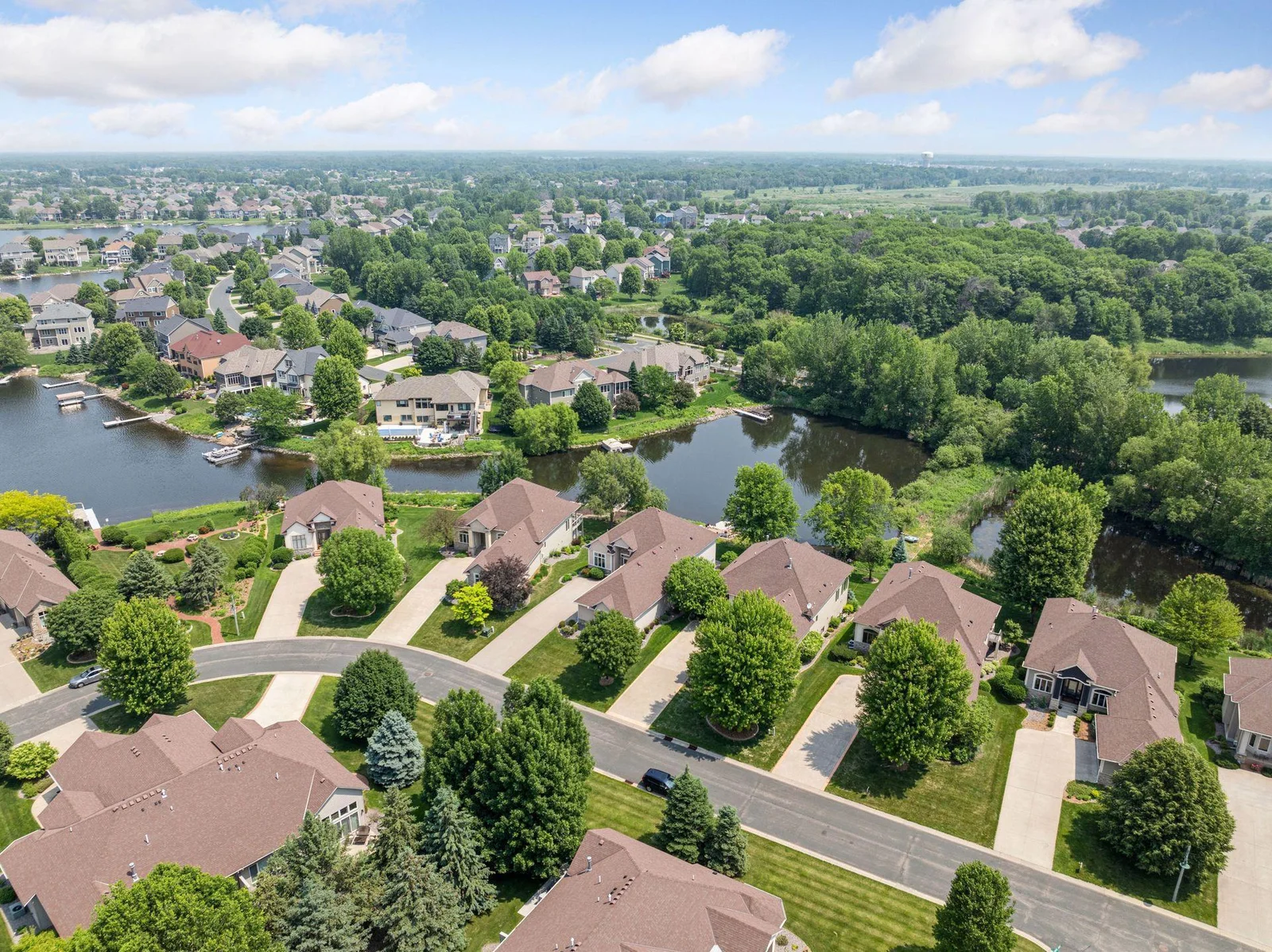 Tree lined neighborhood with trails