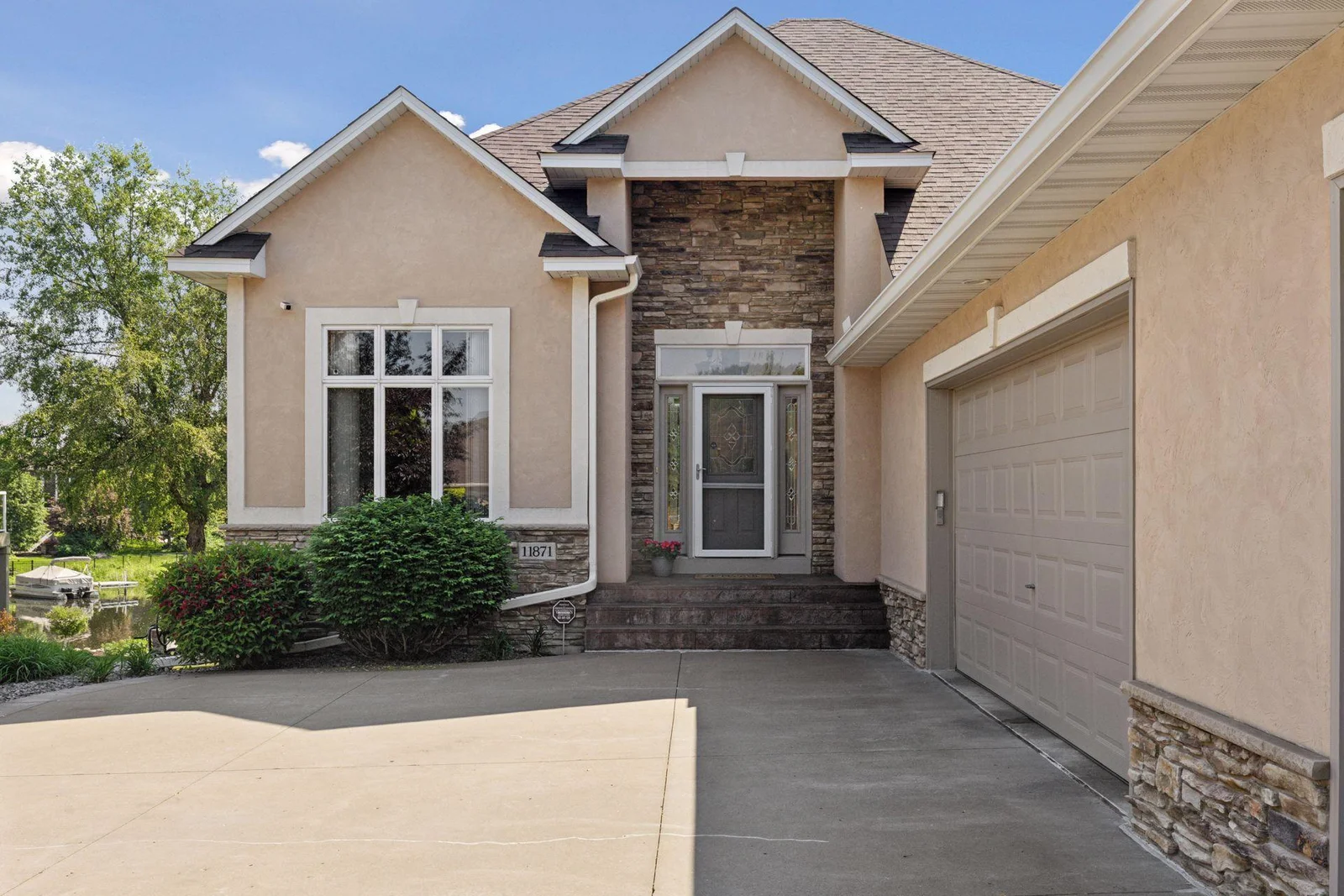 Welcoming Front Door with side lights