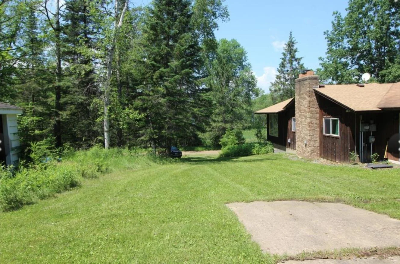 Other side of the house, near garage and main entrance.