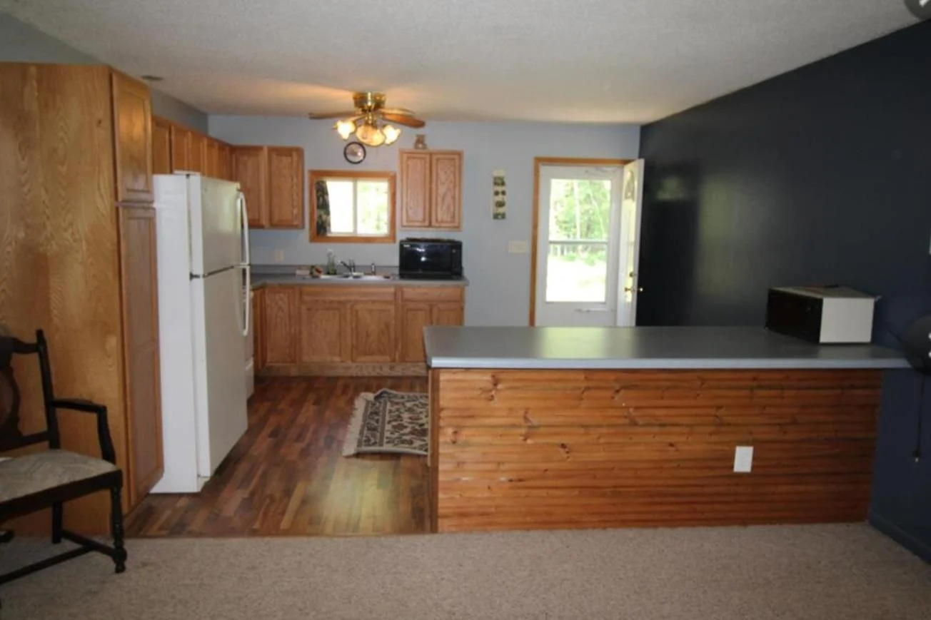 Updated spacious kitchen with breakfast bar.