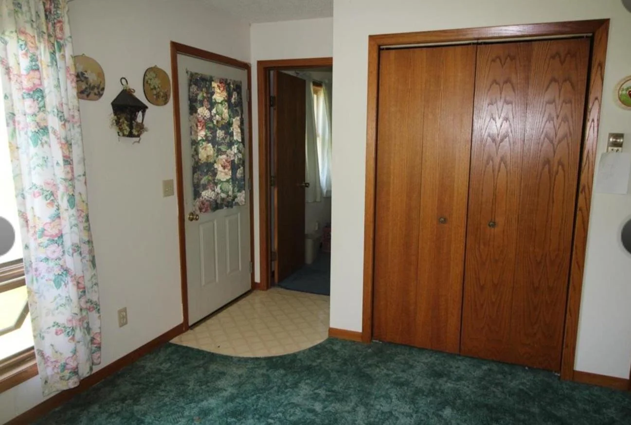 Front door to deck off of living room and a bedroom.
