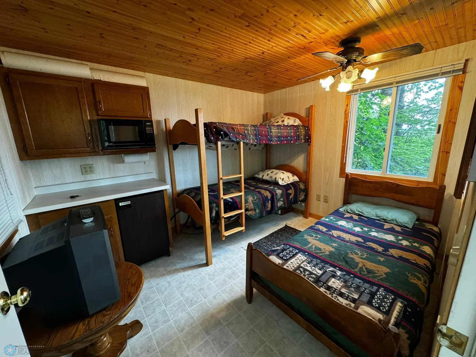 Guest House includes fridge and microwave. Sleeps 4 with full sized bed and twin bunks. Furniture and bedding included!