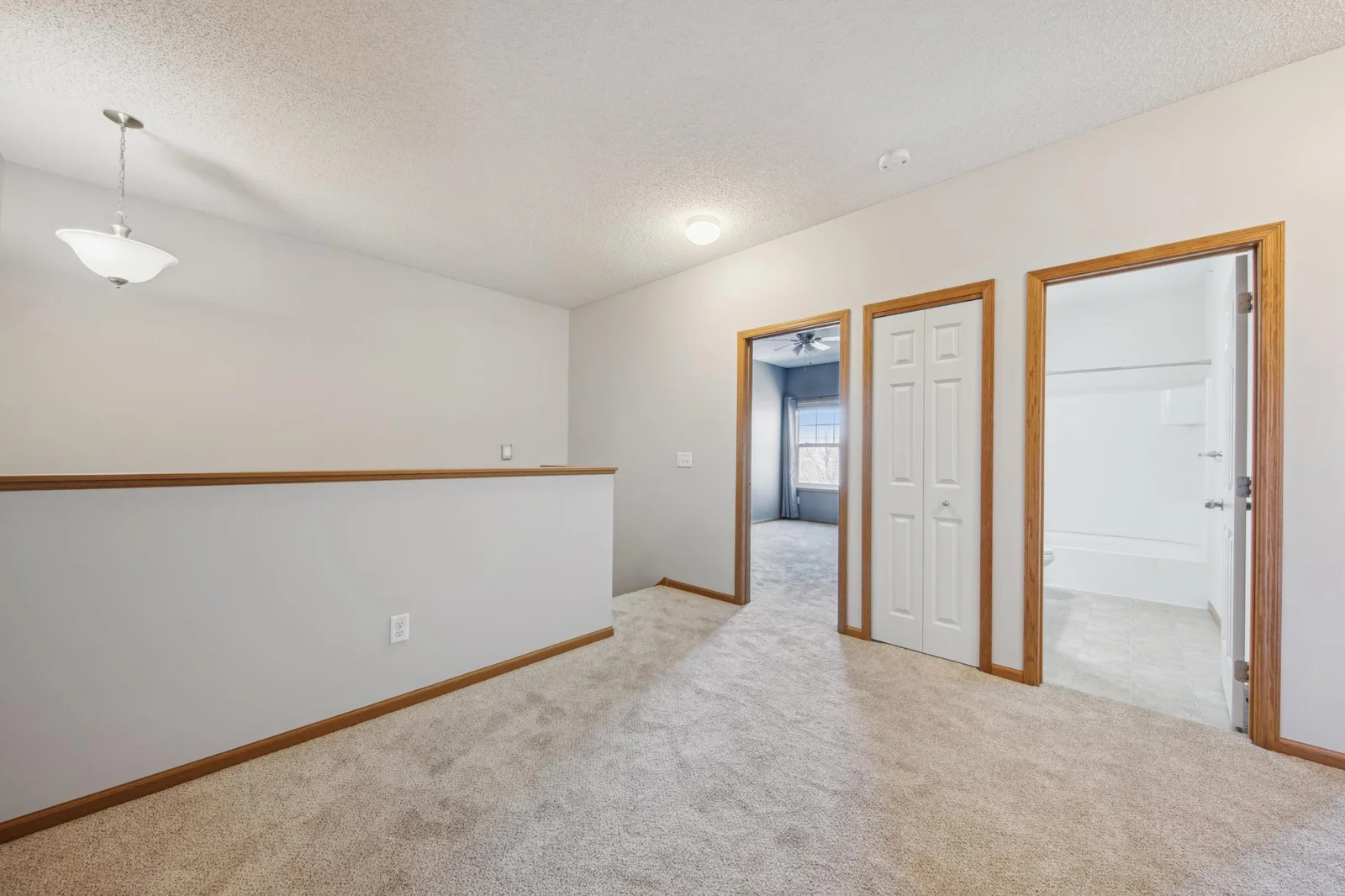 Upper level loft and bedrooms all with new carpet throughout.