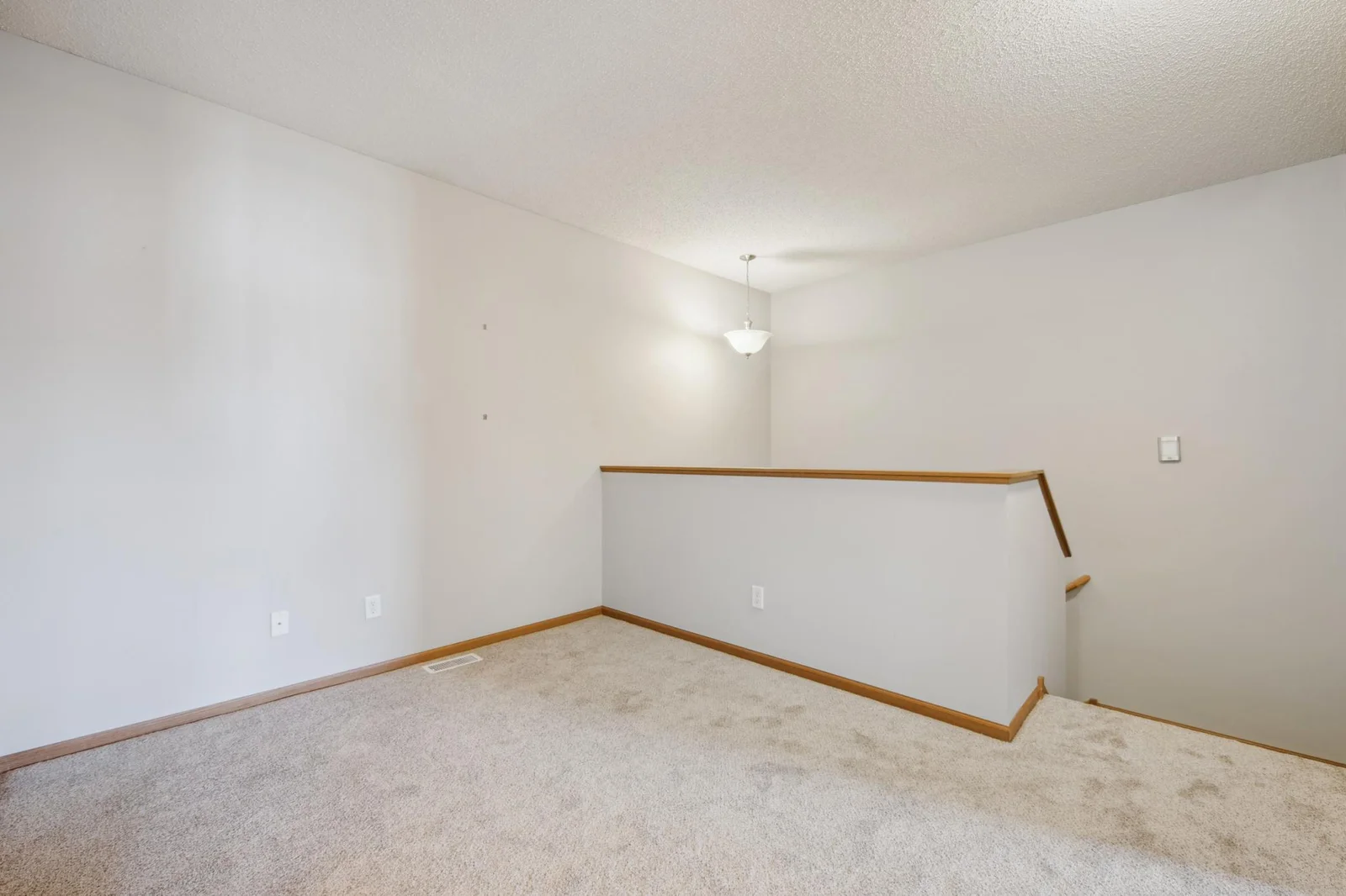 Large upper level landing perfect for a home office or additional family room.