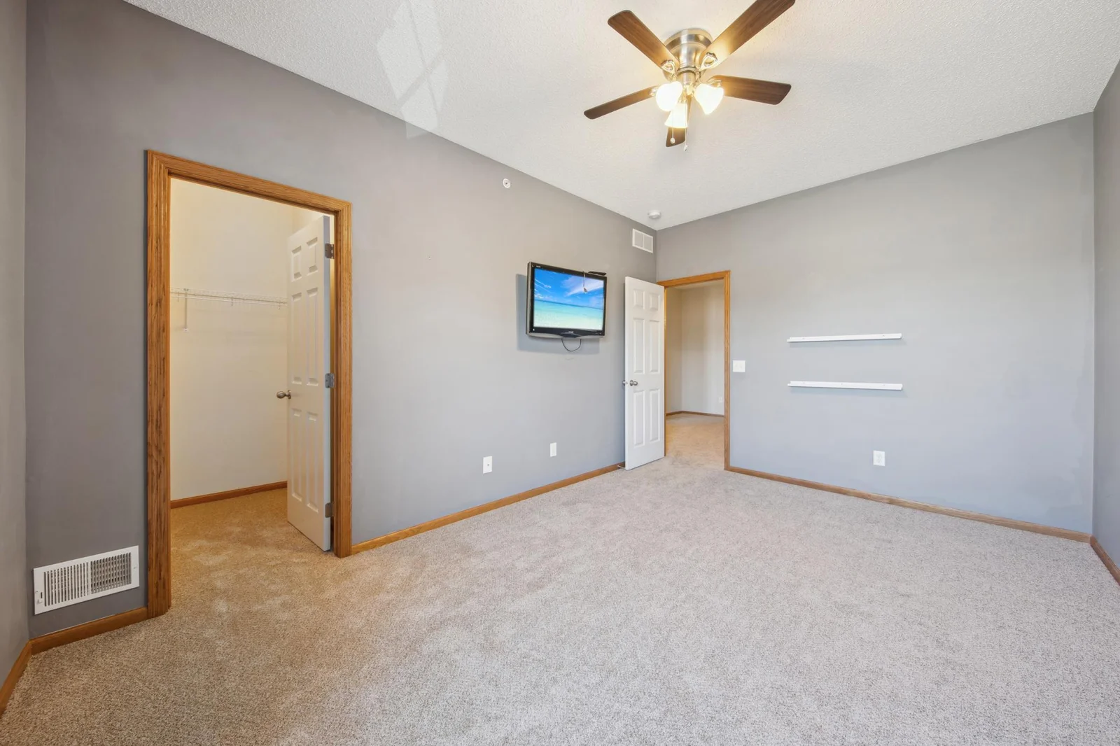 Spacious upper level bedroom with a walk in closet