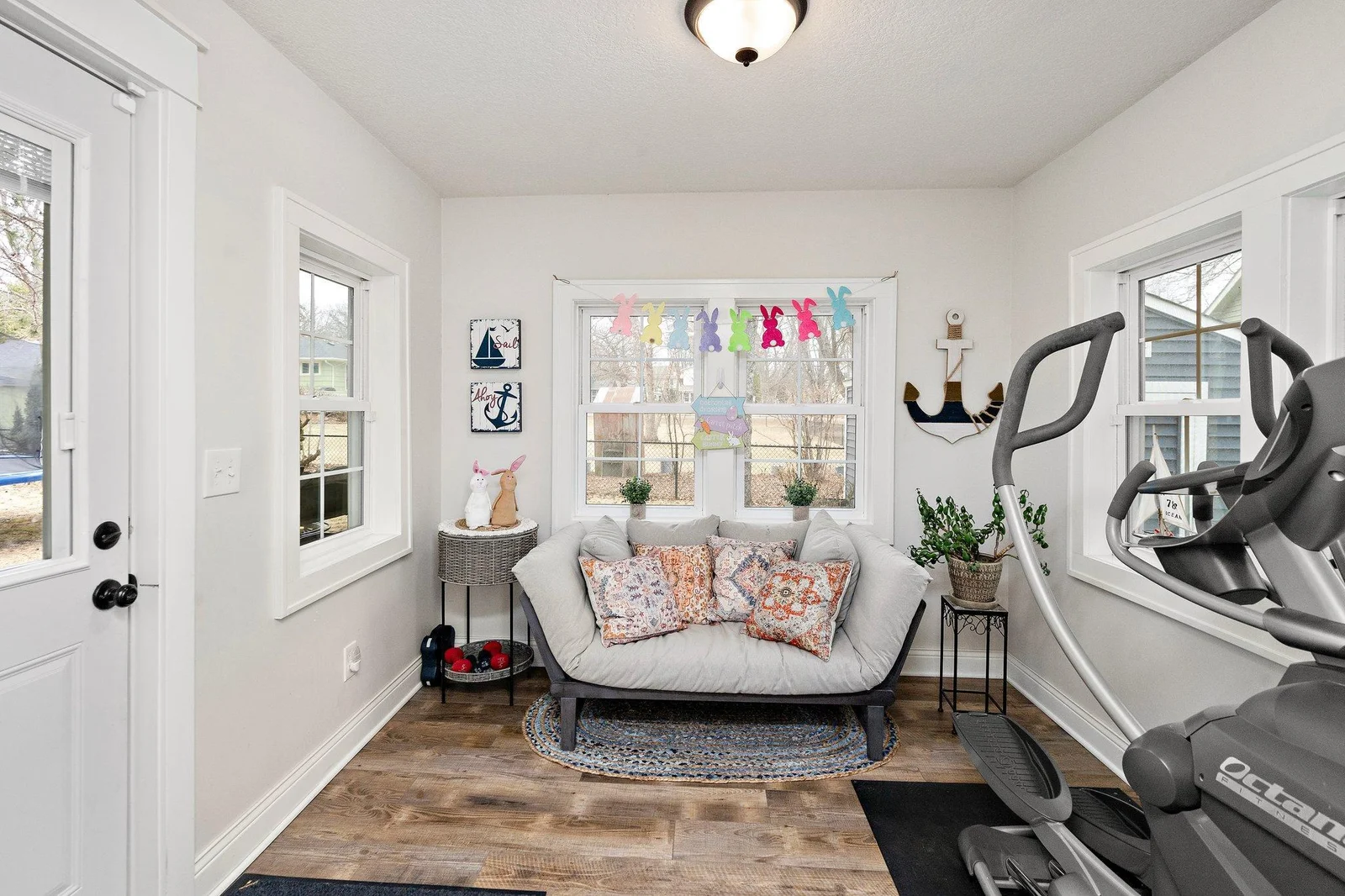 Cozy sunroom that could double as a mudroom for the attached garage!