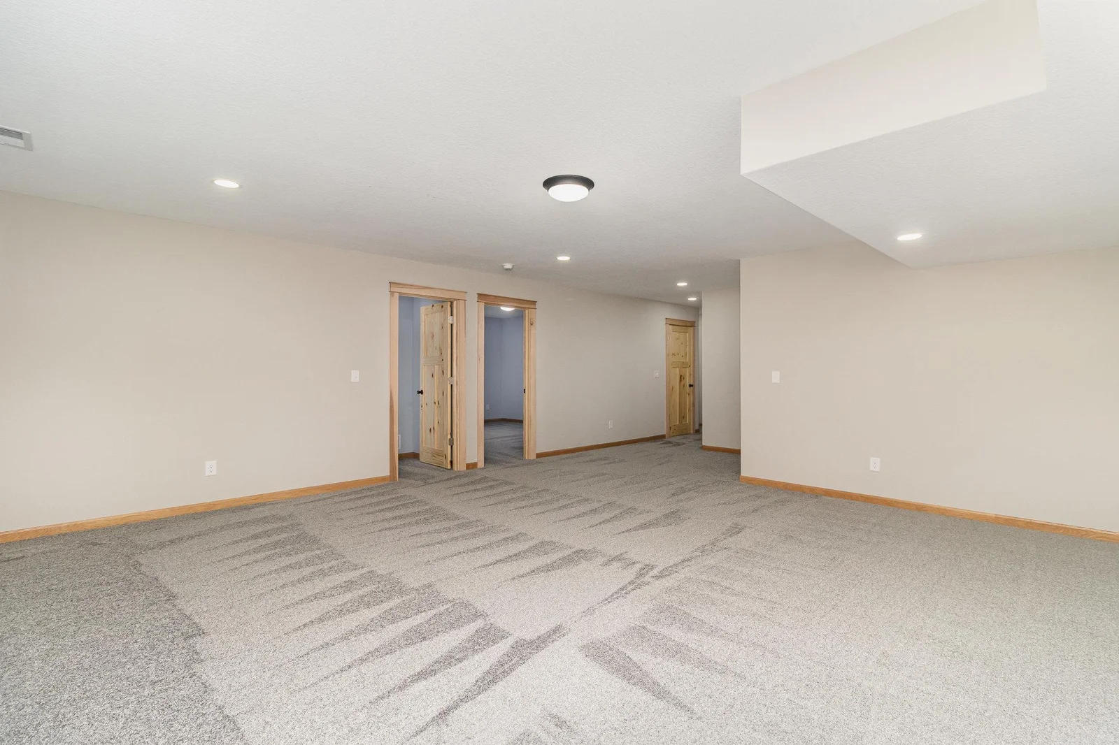 Lower Level Family Room, with Bedrooms 2 & 3.