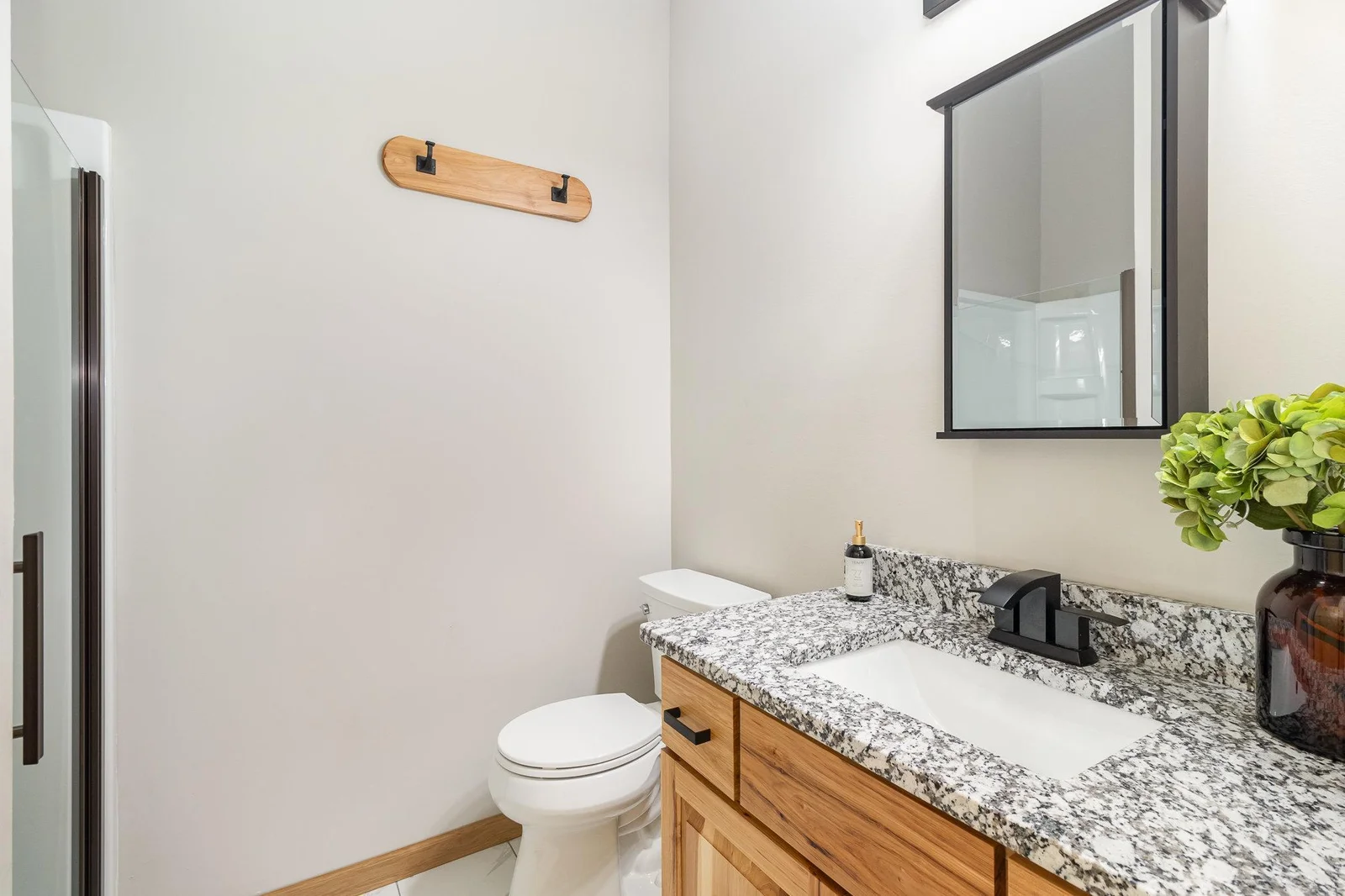Main Level 3/4 bath.  Located off garage entry and mudroom.
