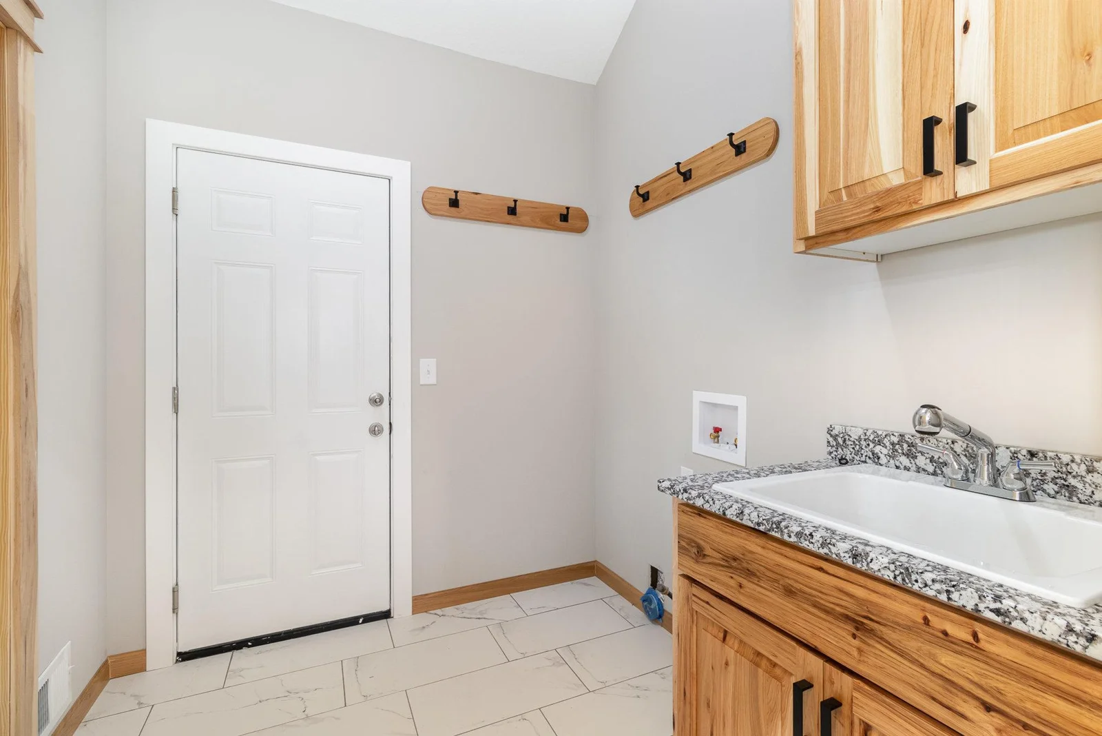 Mudroom and main floor laundry is located off the garage entry.