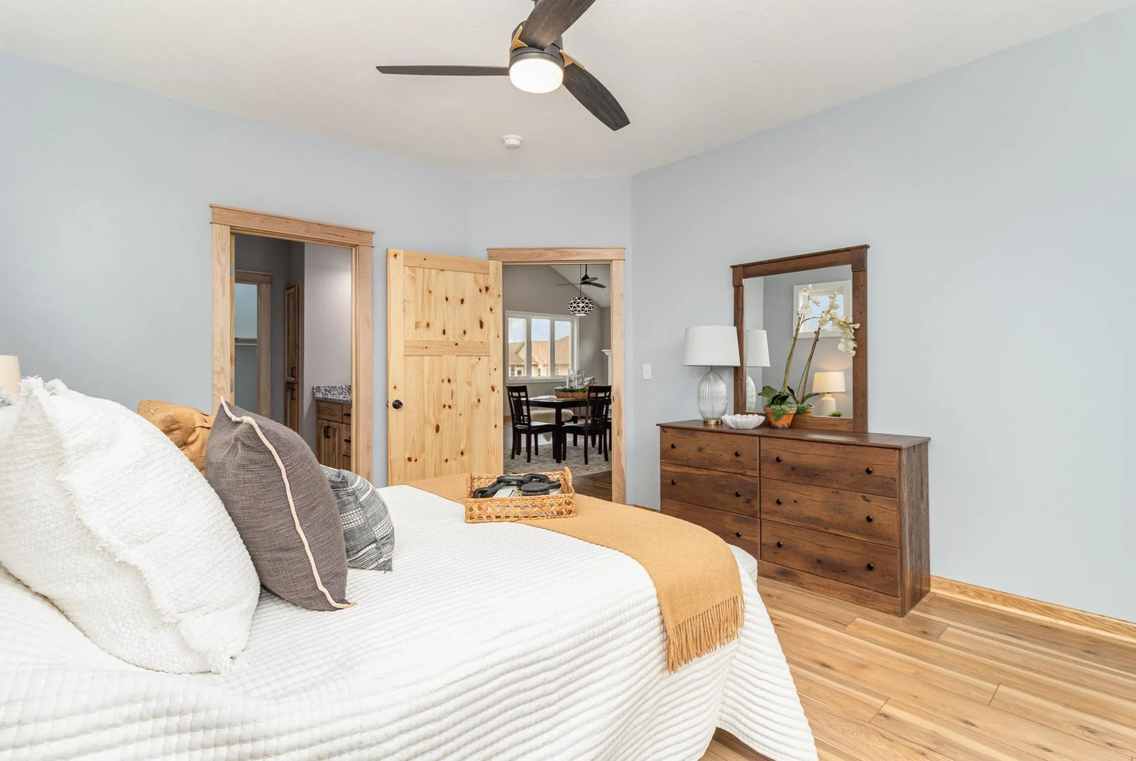 Primary Suite Bedroom.  The entire home has gorgeous solid knotty pine doors.