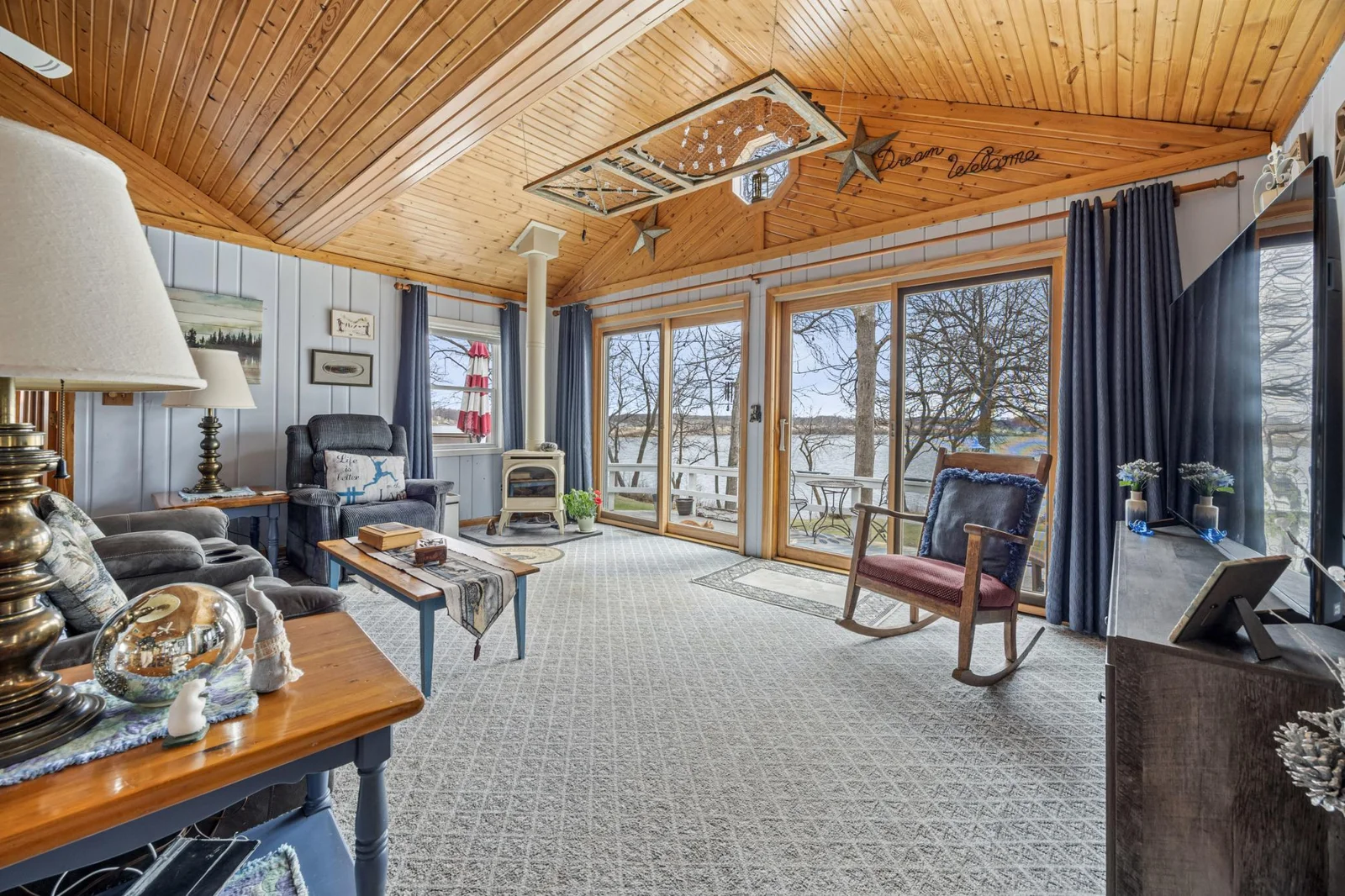 Informal sitting area w/patio door leading to lakeside deck