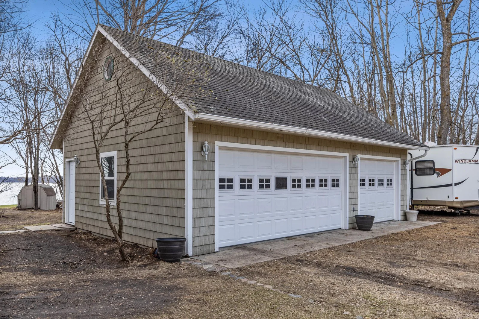 Triple car garage w/cedar siding