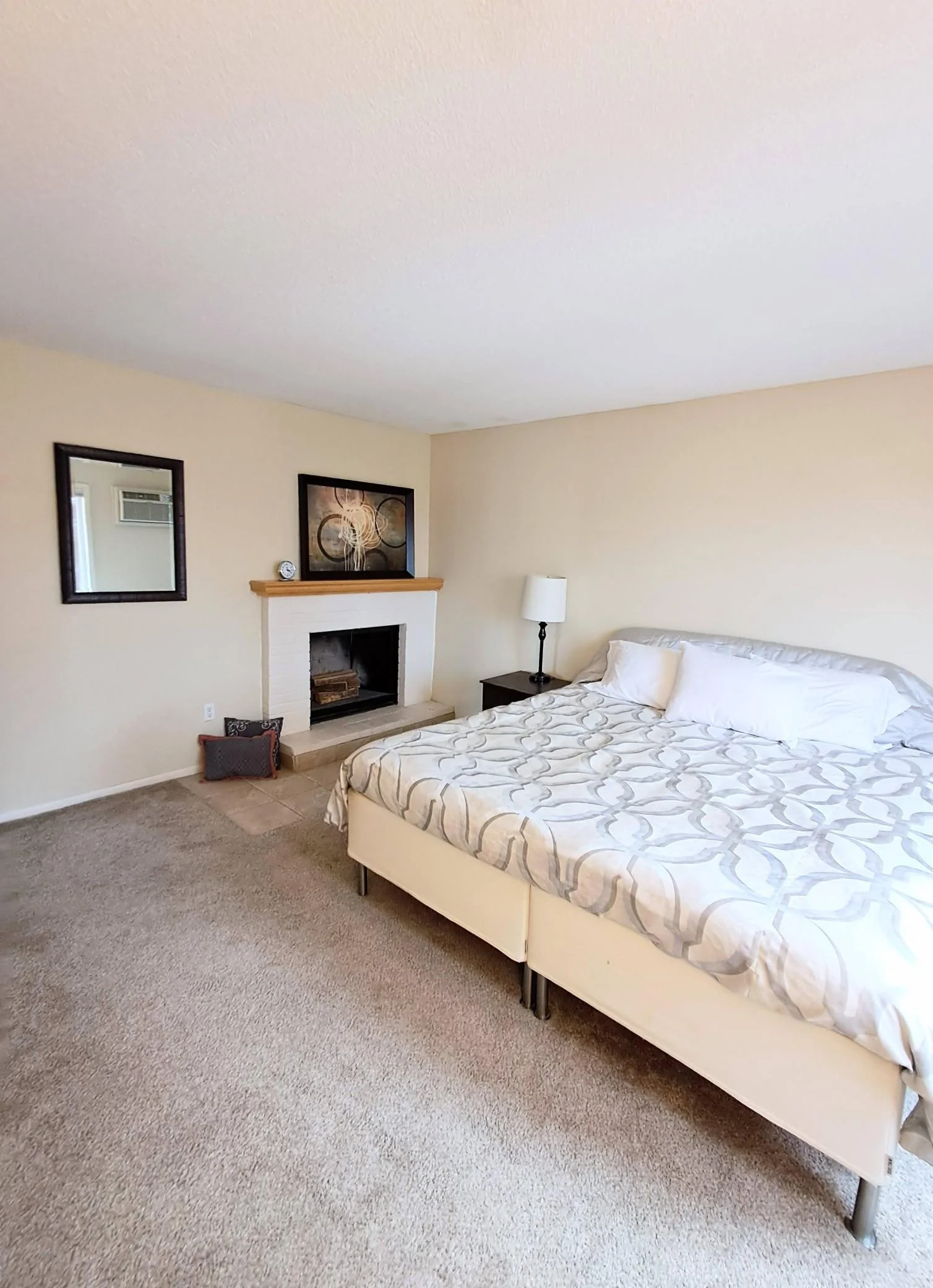 Primary bedroom also has a cozy fireplace.