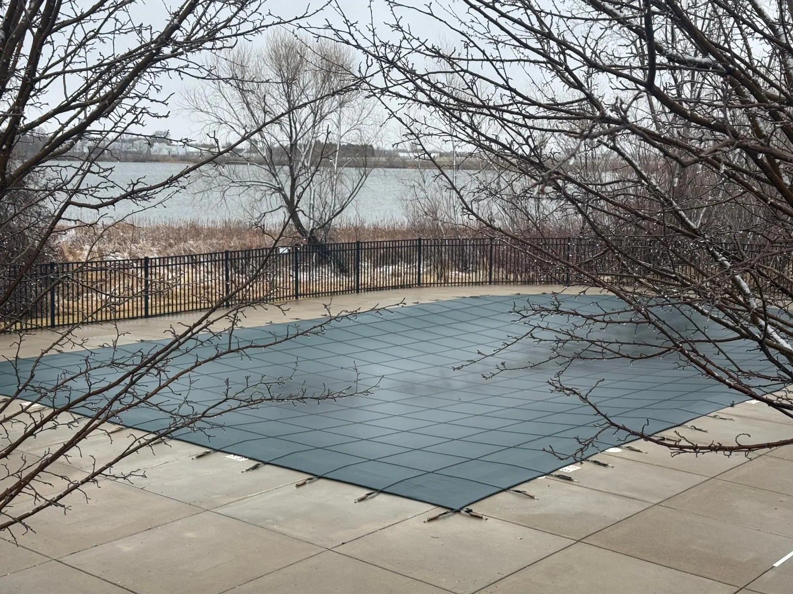 Enjoy the outdoor neighborhood pool with a lake view.