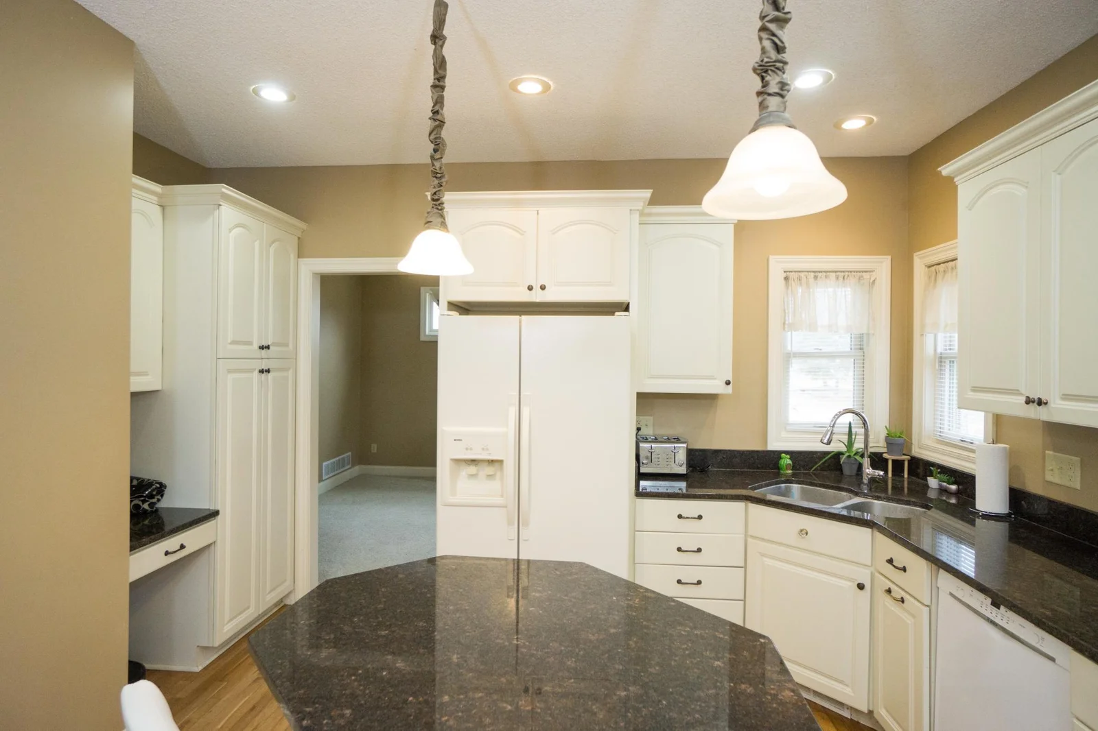 Granite counters, pantry & desk area.