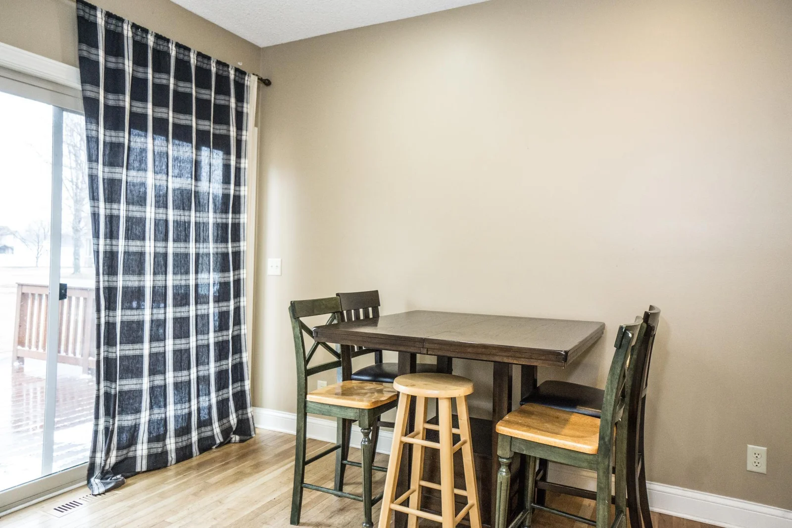 Informal dining overlooks the deck & back yard.