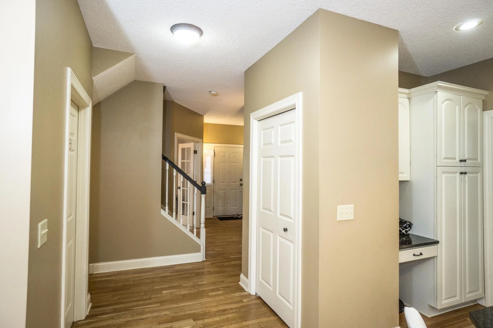 Entry closet and refinished hardwood Cherry floors