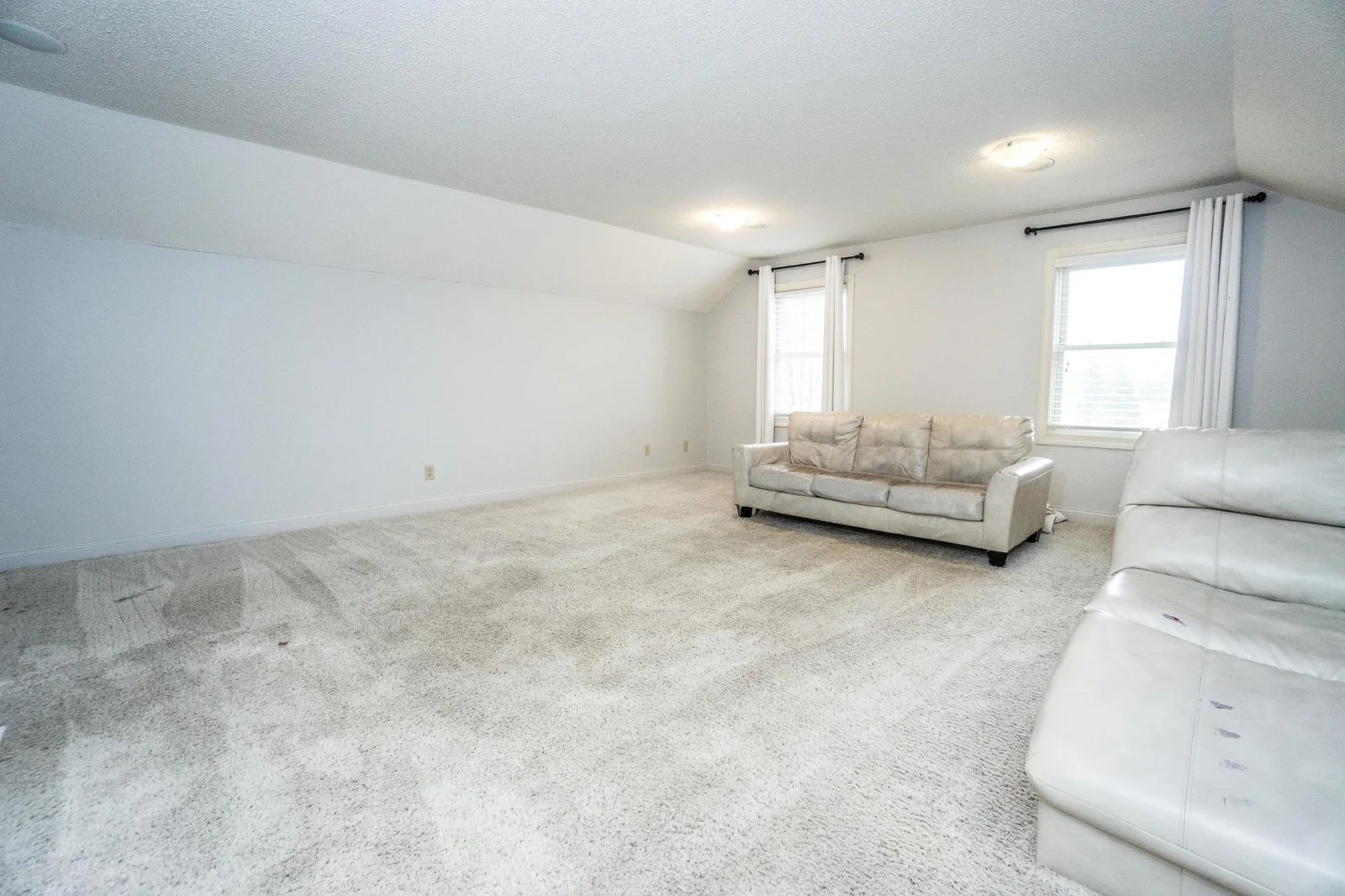 New carpet July 2025 in upstairs family bonus room with new paint.