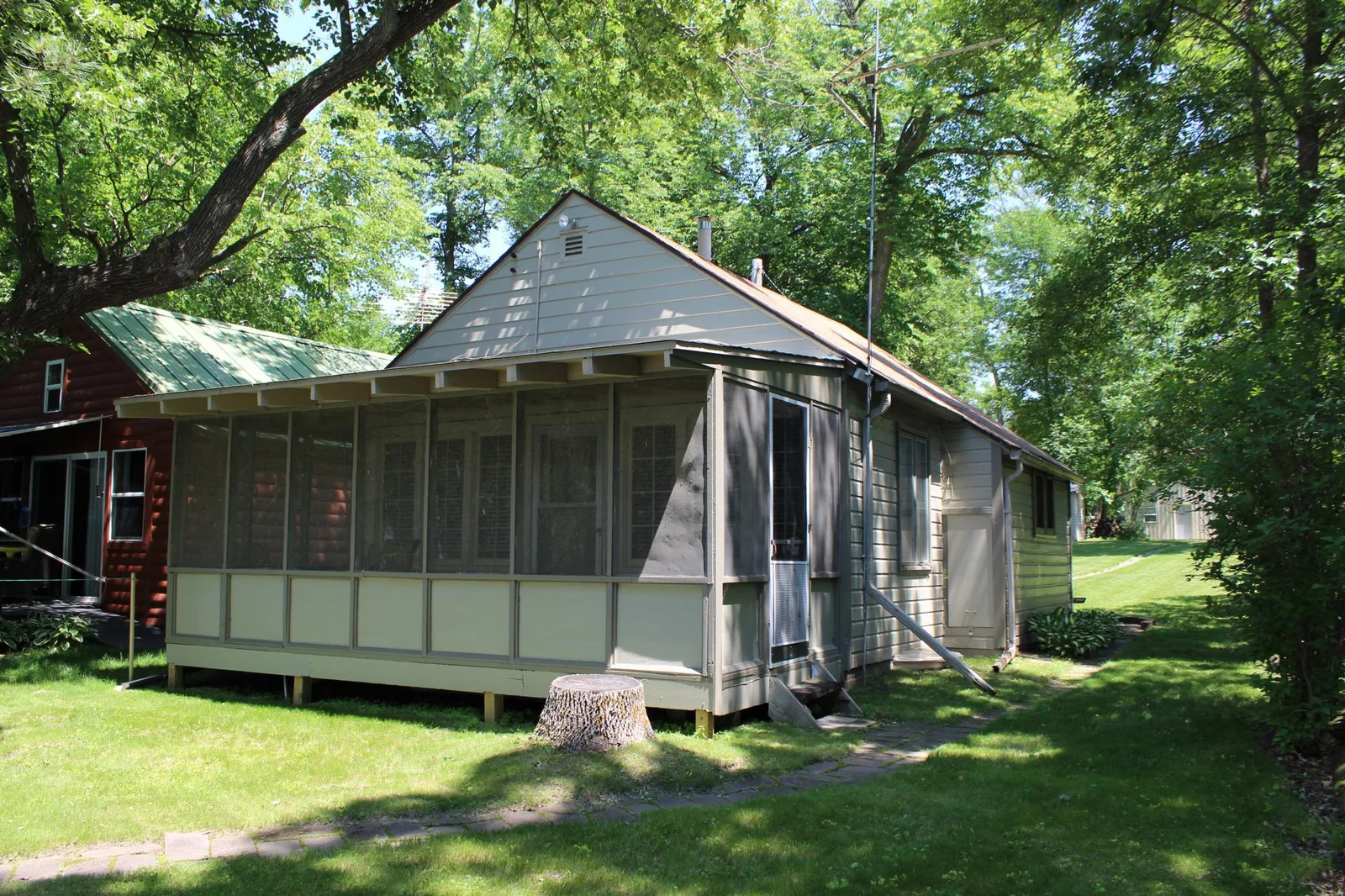 Lakeside of cabin with screen porch