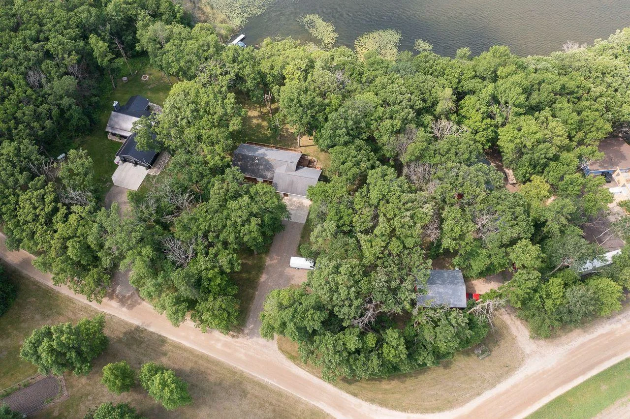 House sheltered by many trees