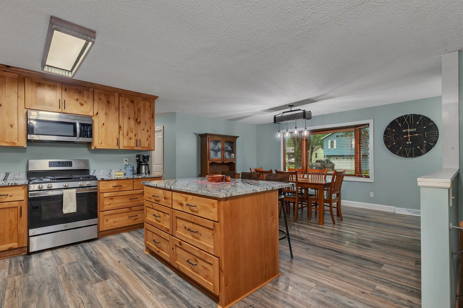 Kitchen island provides additional seating and prep space for cooking, prepping, and gatherings.
