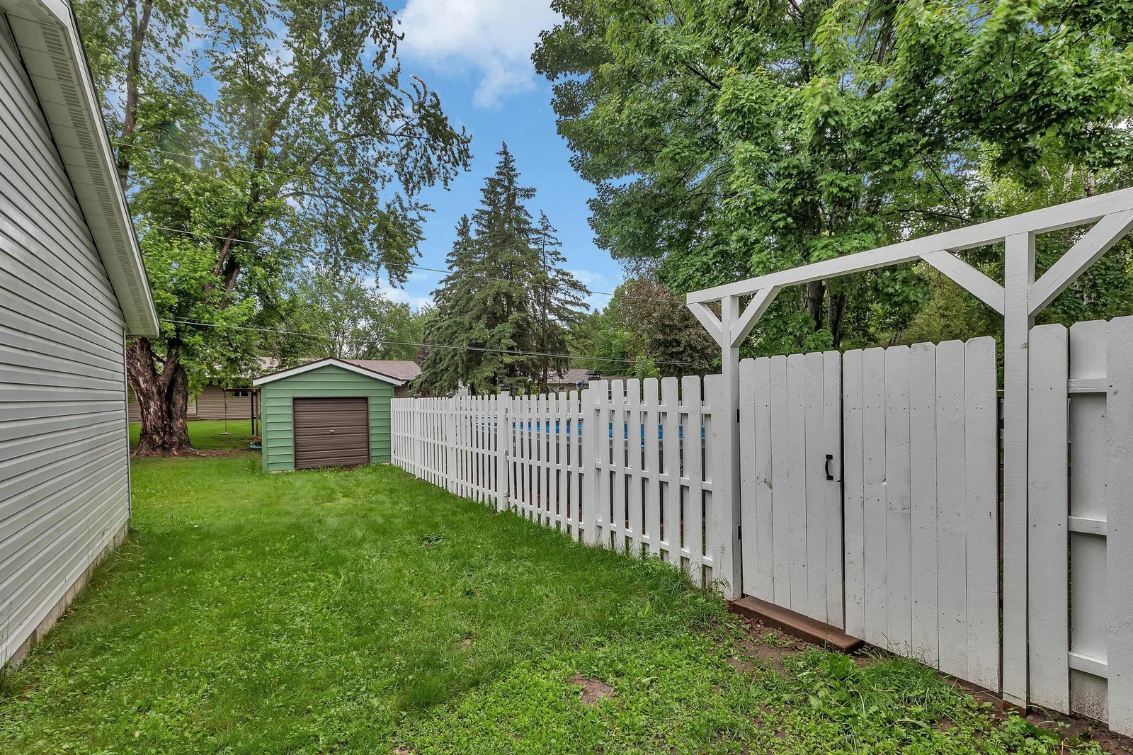 Storage shed (included) and full privacy fence borders the backyard providing additional security for pets and kids wearing off some energy!
