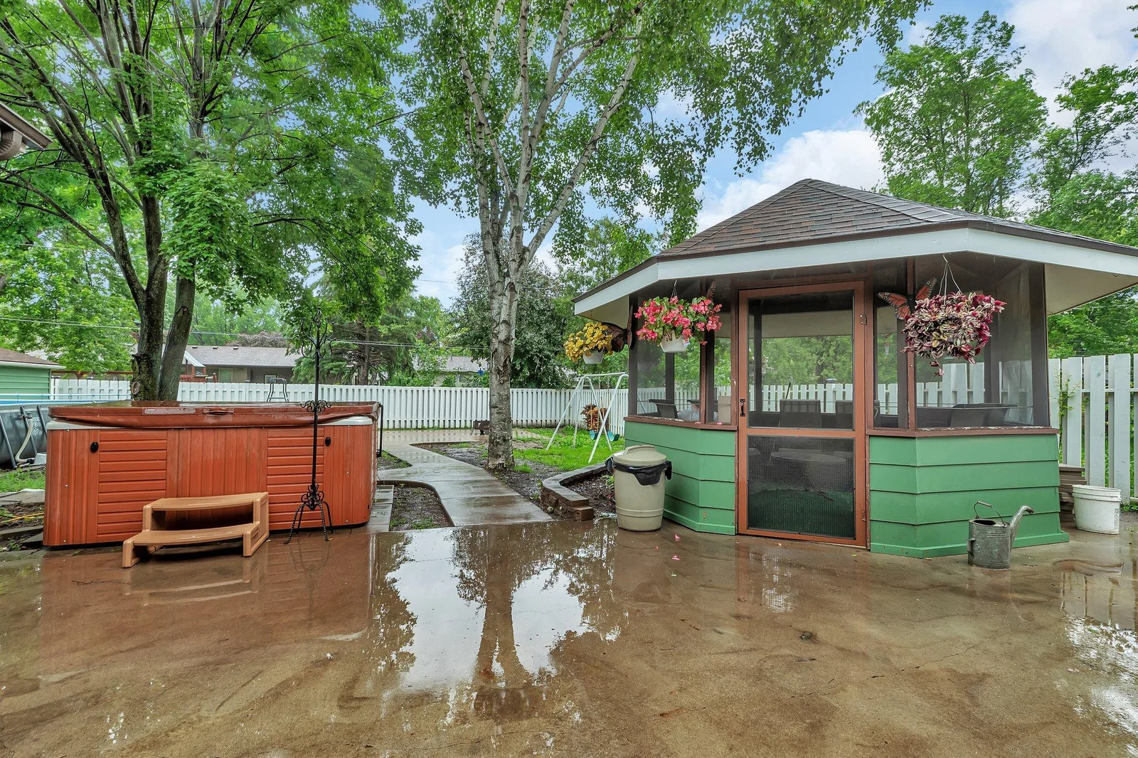 Walk out to massive 30x18 concrete patio. Easily access hot tub and gazebo.