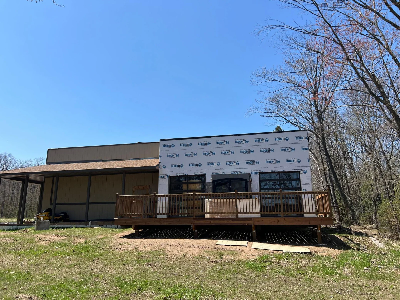 The Party Room leads out to the lakeside deck and is accessible by two glass garage doors and features a large gas fireplace.