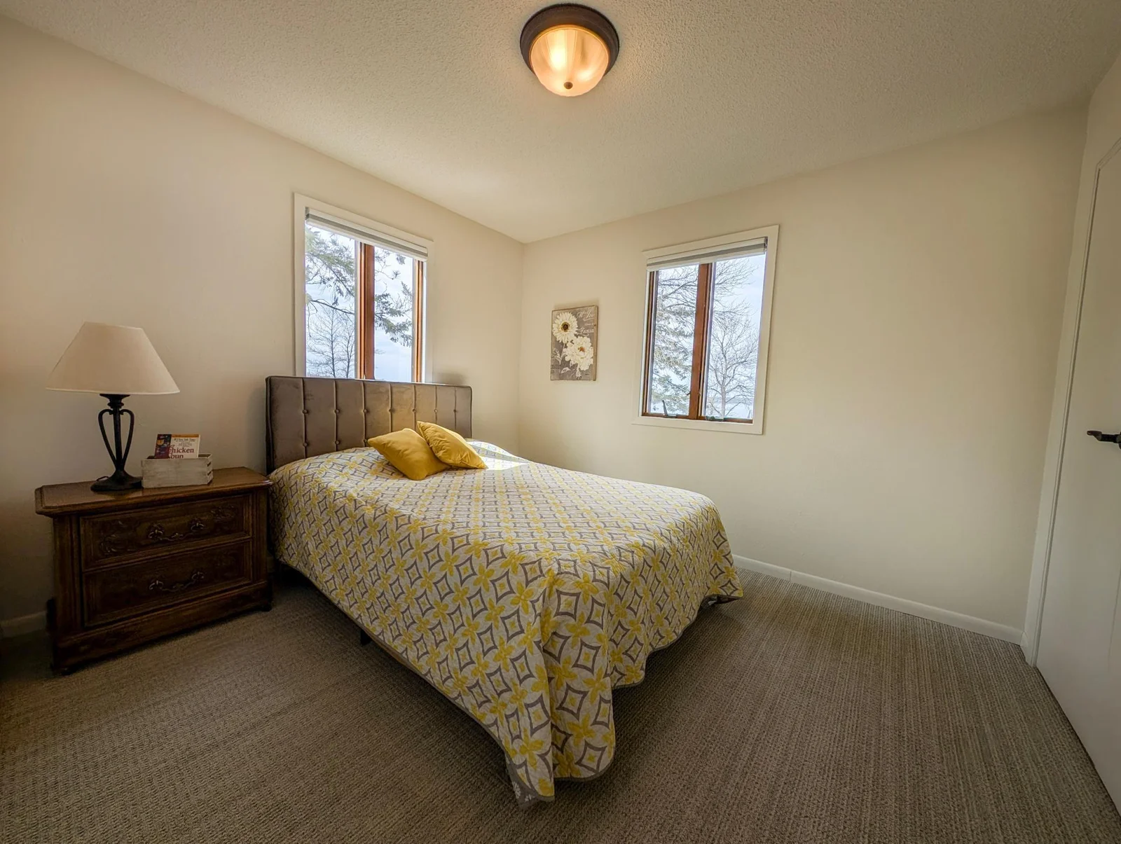 Let the view speak for itself in this light-filled bedroom overlooking the sparkling water.