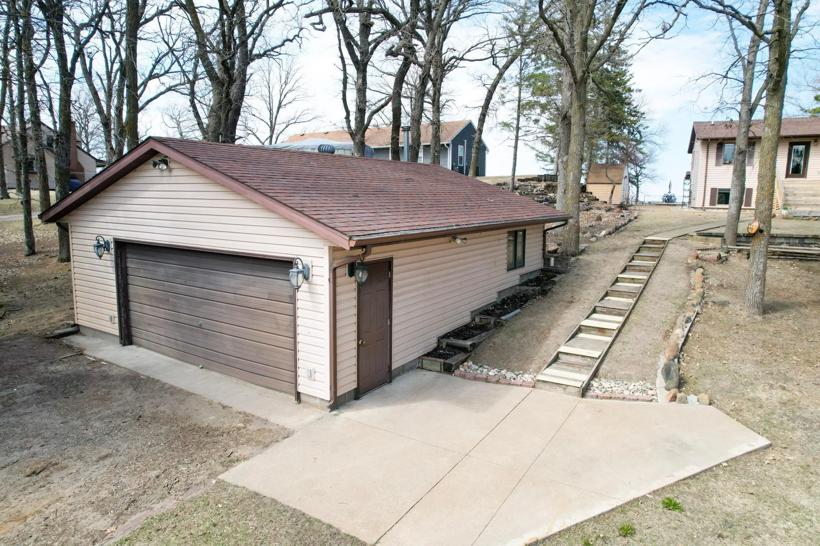 A two-stall detached garage includes a woodshop space.