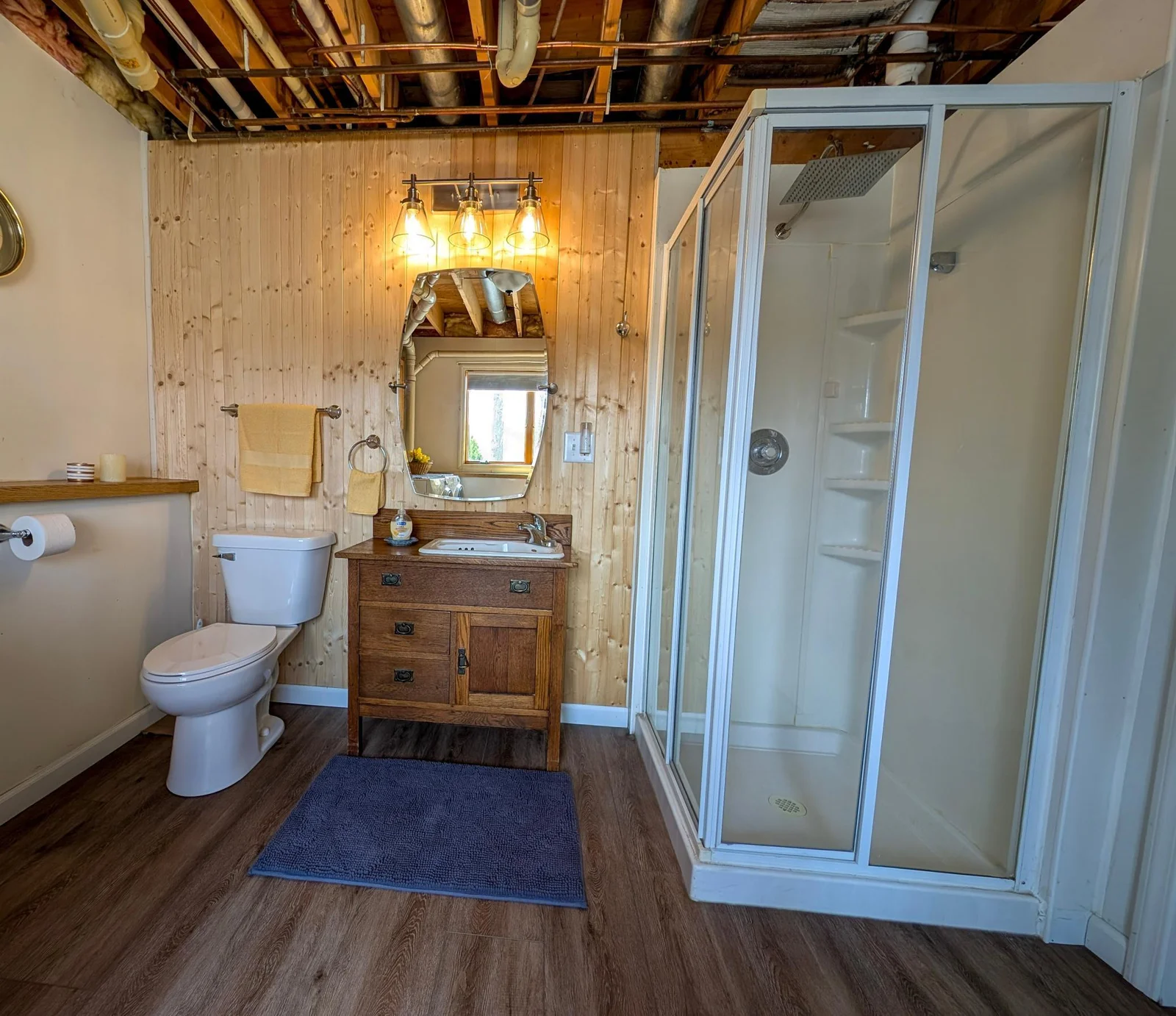 Lower-level bathroom with modern touches and a relaxed vibe.