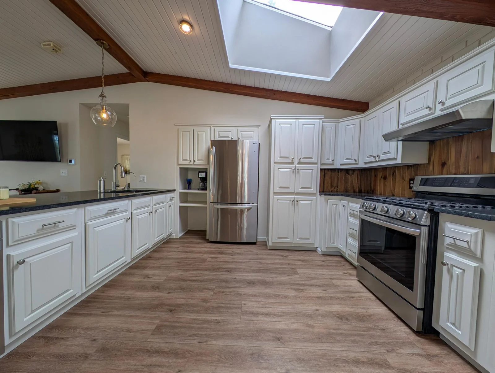 Open-concept kitchen with oversized functional island—perfect for lakeside entertaining and casual meals
