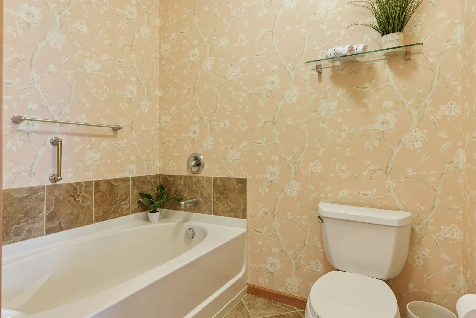 Primary bath separate soaking tub is deep and easy to relax in.