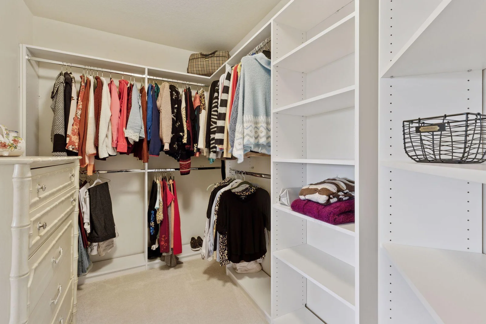Primary bedroom, professionally updated custom walk-in closet.