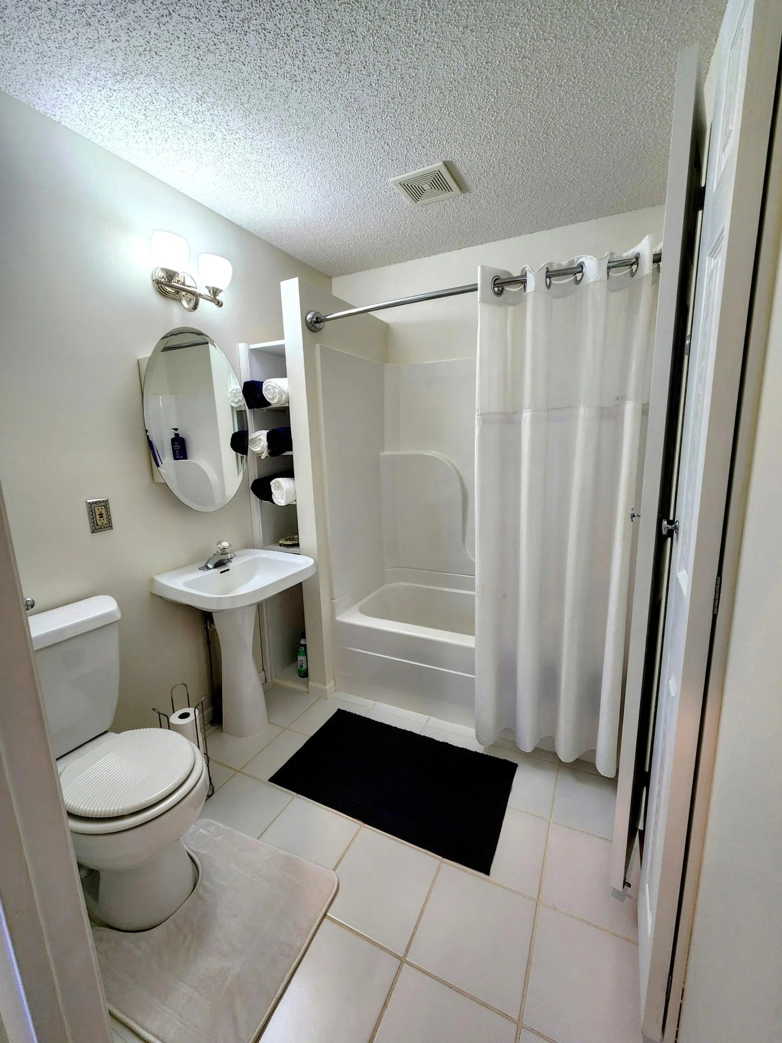 Full bathroom with tile floors in the upper level owner's suite.