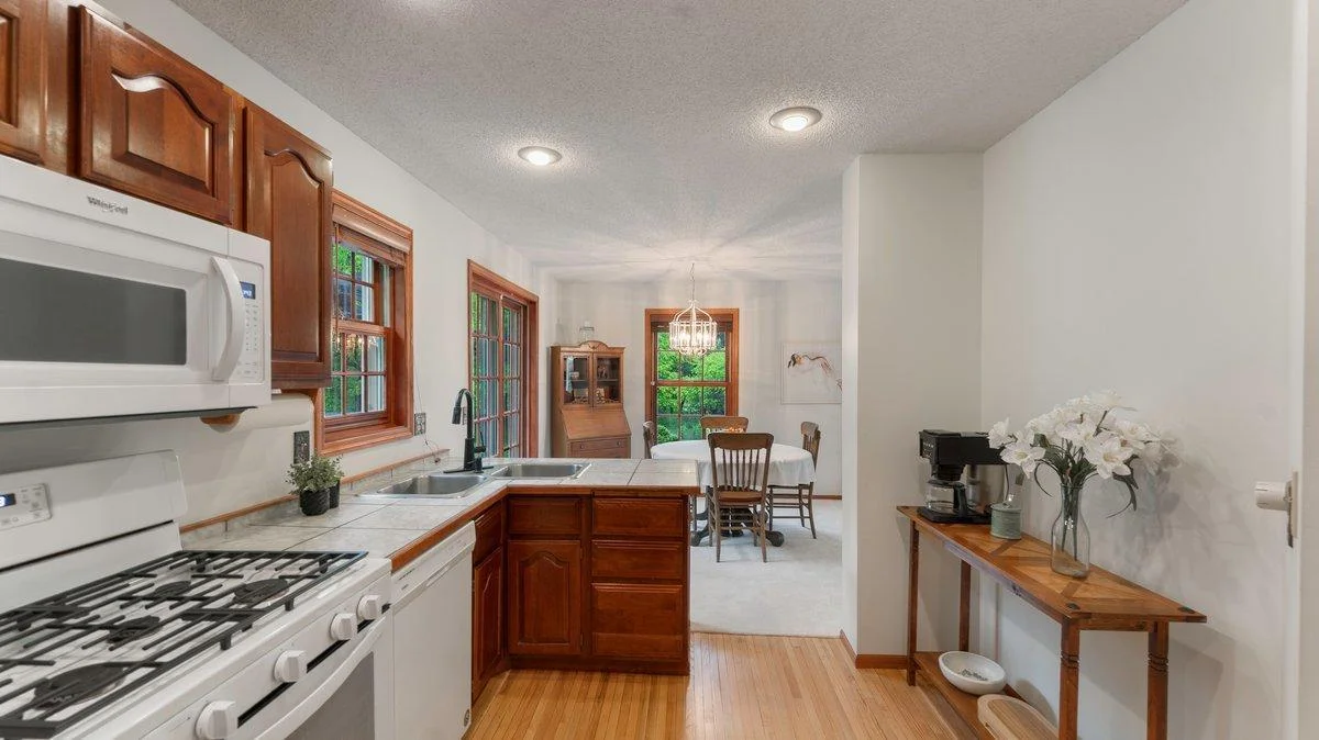 The kitchen has real hardwood floors.