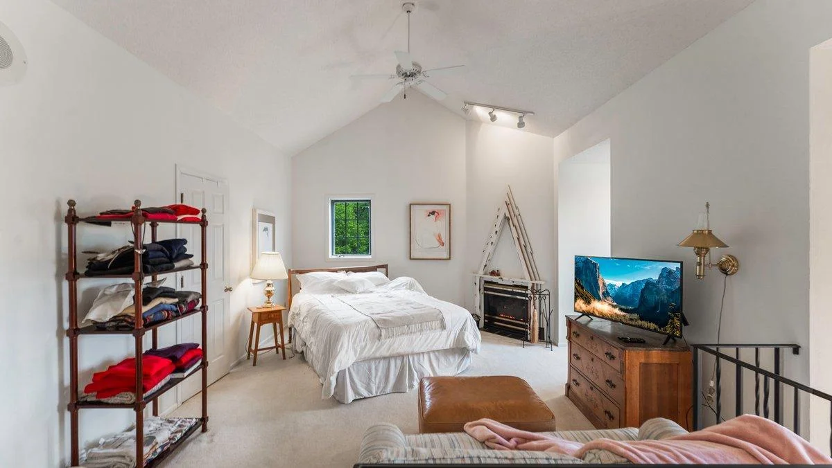 Upper level owner's suite with fireplace.