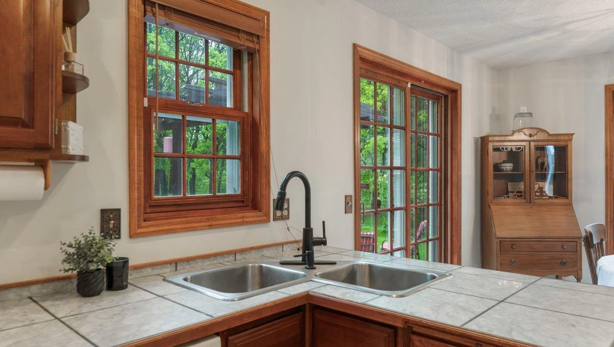 Corner sink with updated faucet.