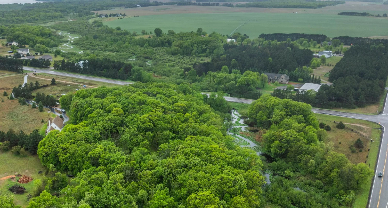 Aerial views. of 12+ acres with the Briggs Creek meandering through.