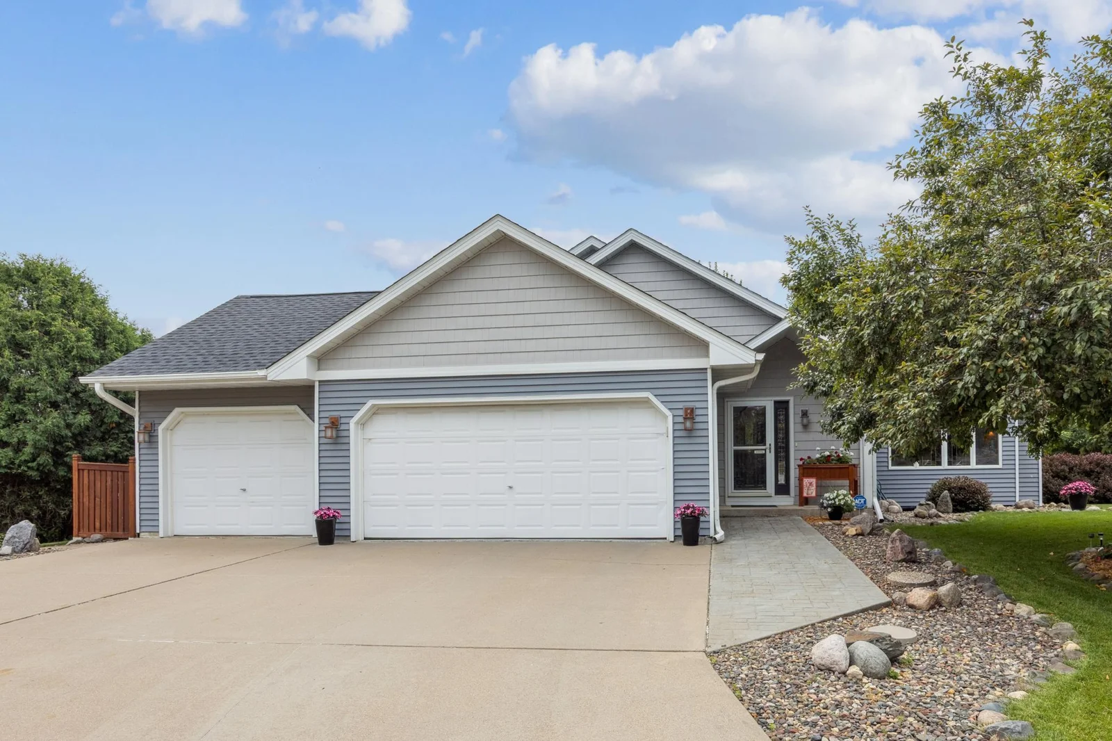 3 car garage, 2 year old roof and concrete driveway