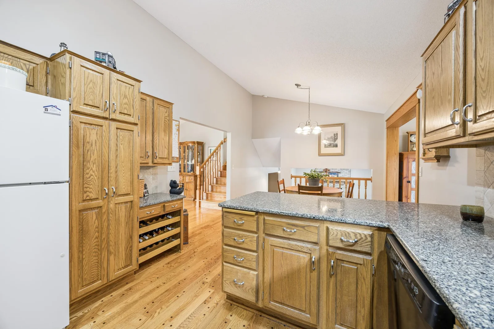 Spacious kitchen with hardwood floors &  upgraded countertops