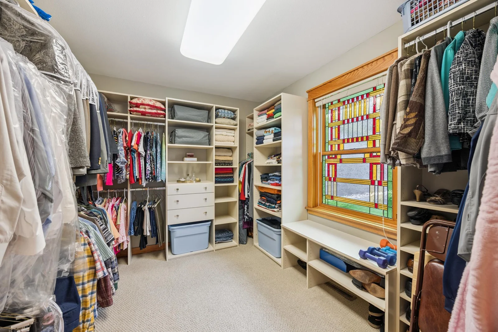 Custom Closet and beautiful stained glass window